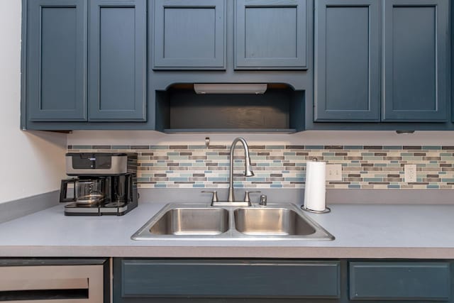129 Plantation Dr, Lawrenceburg, KY 40342 - kitchen featuring blue cabinetry, light countertops, and decorative backsplash