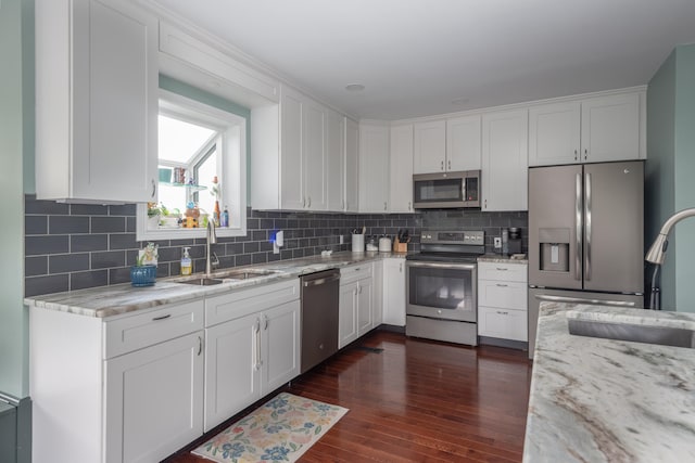 1000 Sunnyview Ln, Frankfort, KY 40601 - kitchen featuring stainless steel appliances, white cabinetry, and light stone countertops