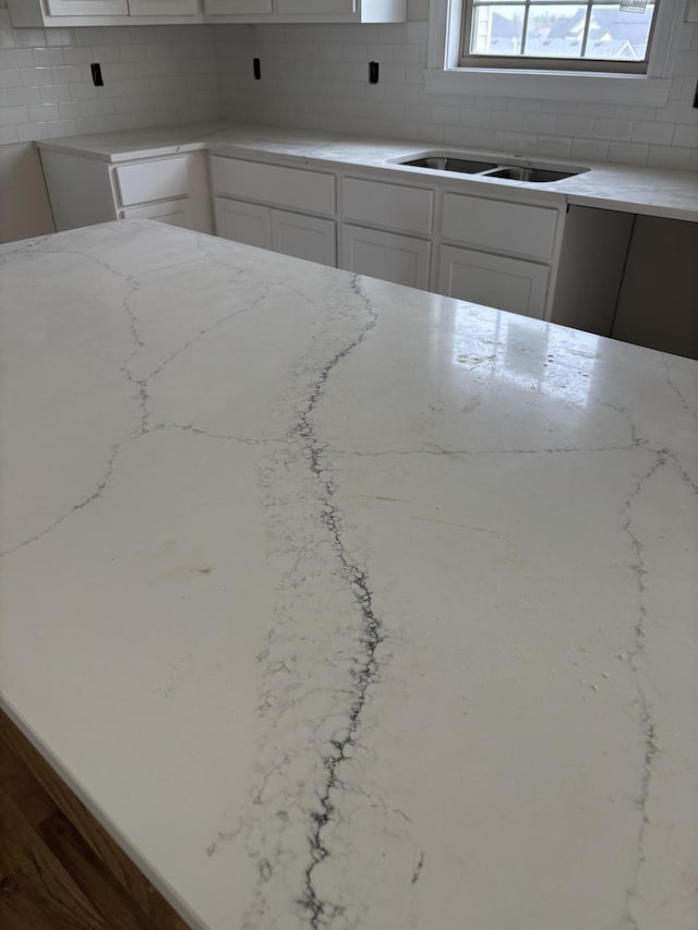 2716 Kearney Creek Ln, Lexington, KY 40511 - kitchen with light stone countertops, decorative backsplash, and white cabinets