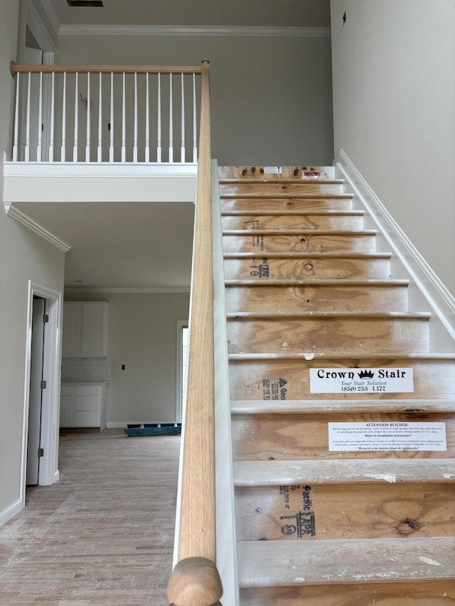 2716 Kearney Creek Ln, Lexington, KY 40511 - stairs with crown molding and wood finished floors