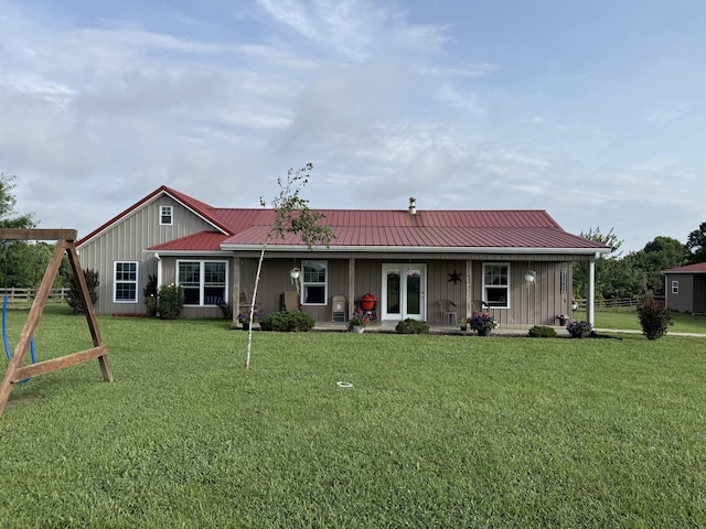 402 Allen Rd, Waynesburg, KY 40489 - rear view of property with board and batten siding, a yard, and a metal roof