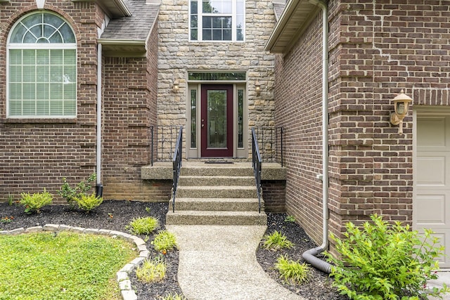 904 Belmere Dr, Lexington, KY 40509 - doorway to property featuring a garage, brick siding, and stone siding