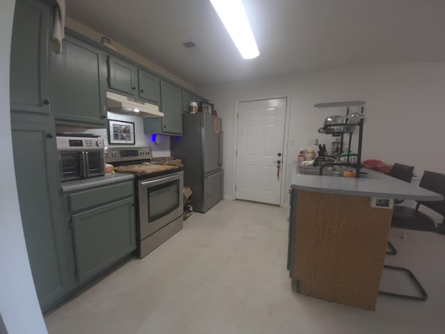 3004 Bell Ct, Richmond, KY 40475 - kitchen with stainless steel appliances, under cabinet range hood, a kitchen breakfast bar, and a peninsula