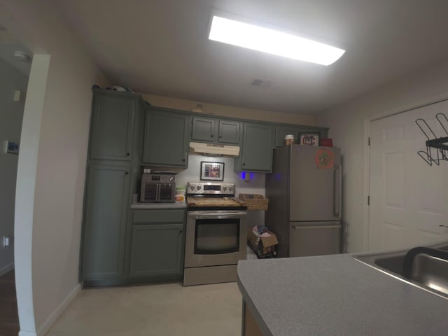3004 Bell Ct, Richmond, KY 40475 - kitchen featuring stainless steel electric stove, freestanding refrigerator, and under cabinet range hood
