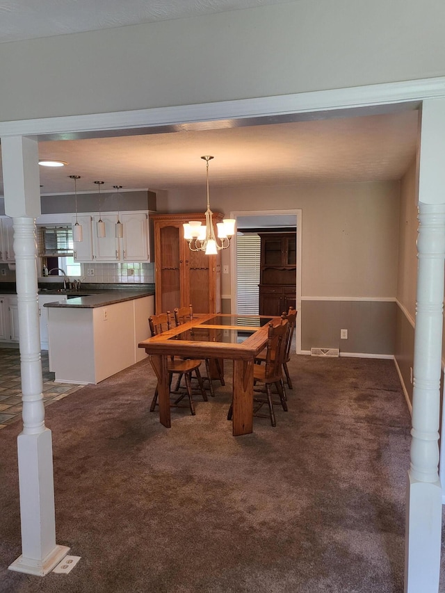 664 Linda Ave, Danville, KY 40422 - dining space with dark colored carpet and a chandelier