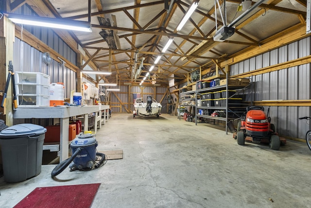 1020 Cornish Ln, Lawrenceburg, KY 40342 - garage with a garage door opener, a workshop area, and metal wall