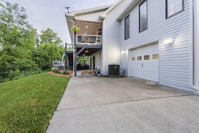 1020 Cornish Ln, Lawrenceburg, KY 40342 - view of home's exterior with an attached garage, a balcony, a yard, and driveway
