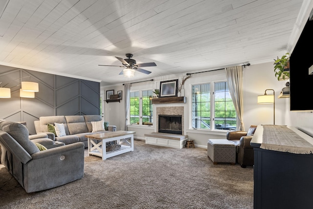 1020 Cornish Ln, Lawrenceburg, KY 40342 - carpeted living room with ornamental molding, a ceiling fan, and a stone fireplace