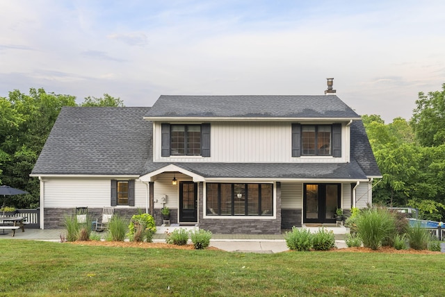 1020 Cornish Ln, Lawrenceburg, KY 40342 - view of front of house with a porch, stone siding, and a front lawn