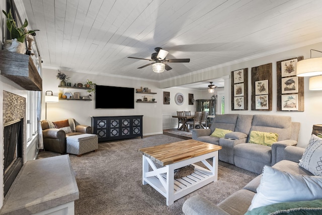 1020 Cornish Ln, Lawrenceburg, KY 40342 - carpeted living room featuring a ceiling fan, ornamental molding, a fireplace, and wood ceiling