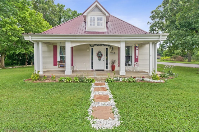 702 E 2nd St, Russellville, KY 42276 - view of front of property with a porch, a front yard, and a metal roof