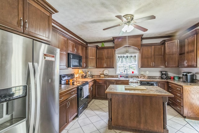 702 E 2nd St, Russellville, KY 42276 - kitchen with black appliances, light tile patterned floors, ornamental molding, a ceiling fan, and a center island