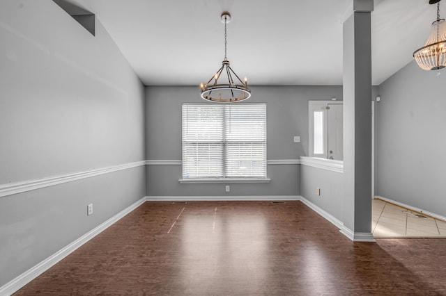 2916 Sandersville Rd, Lexington, KY 40511 - unfurnished dining area with a chandelier and wood finished floors