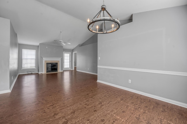 2916 Sandersville Rd, Lexington, KY 40511 - unfurnished living room with a chandelier, a ceiling fan, a glass covered fireplace, wood finished floors, and high vaulted ceiling