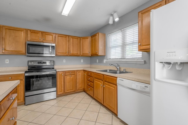 2916 Sandersville Rd, Lexington, KY 40511 - kitchen featuring appliances with stainless steel finishes, light countertops, and light tile patterned floors