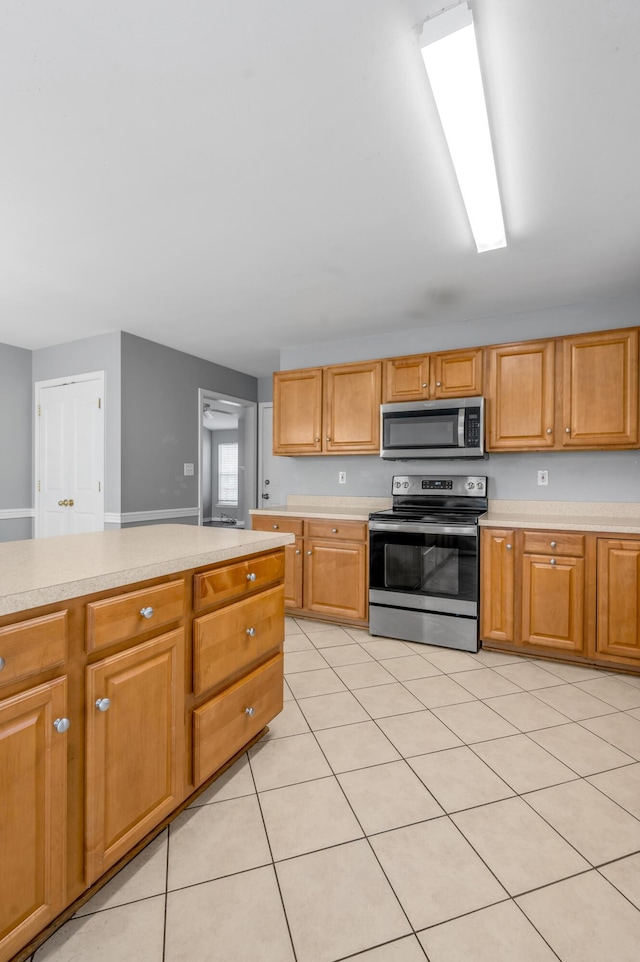 2916 Sandersville Rd, Lexington, KY 40511 - kitchen featuring appliances with stainless steel finishes, light countertops, and light tile patterned floors