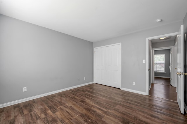 2916 Sandersville Rd, Lexington, KY 40511 - unfurnished bedroom featuring dark wood-style floors and a closet