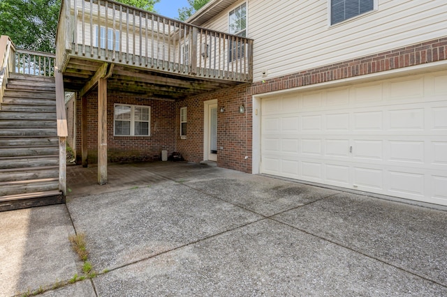 2916 Sandersville Rd, Lexington, KY 40511 - view of patio / terrace with concrete driveway, a deck, stairs, and a garage
