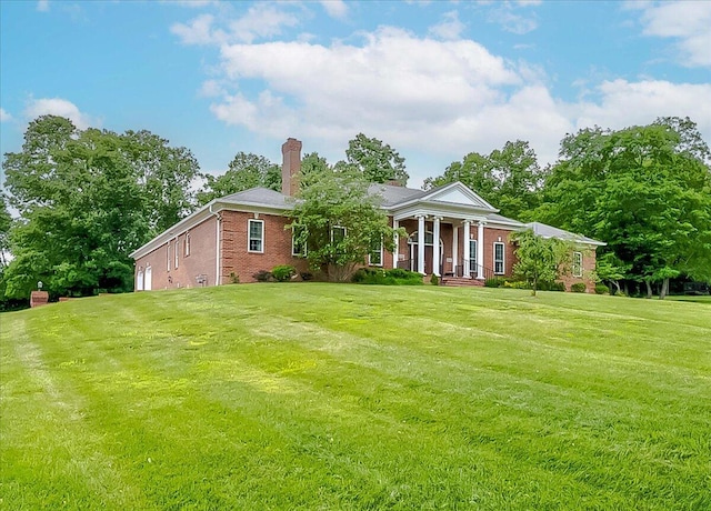 1758 Airdrie Ln, Frankfort, KY 40601 - neoclassical home with brick siding, a chimney, and a front yard