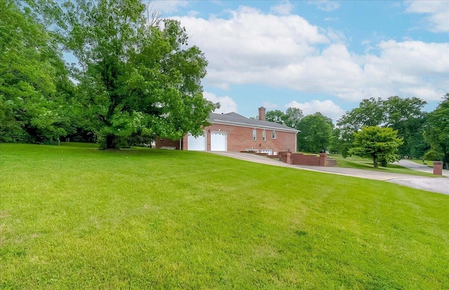 1758 Airdrie Ln, Frankfort, KY 40601 - view of green lawn with driveway and a garage