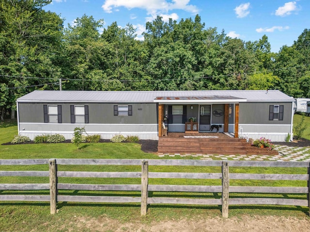 1100 Doublegate Rd, Jeffersonville, KY 40337 - manufactured / mobile home featuring a porch and a fenced front yard