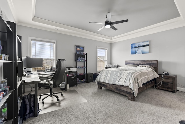176 Cross Park Dr, Georgetown, KY 40324 - carpeted bedroom featuring a tray ceiling, multiple windows, crown molding, an office area, and ceiling fan