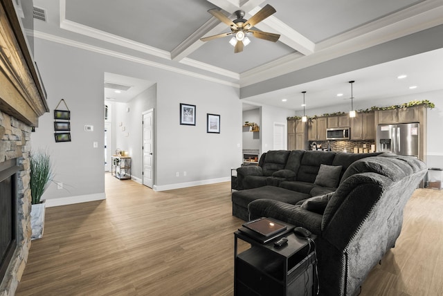 176 Cross Park Dr, Georgetown, KY 40324 - living room featuring ceiling fan, a stone fireplace, recessed lighting, light wood-type flooring, and beamed ceiling