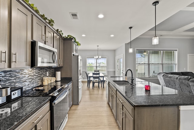 176 Cross Park Dr, Georgetown, KY 40324 - kitchen featuring appliances with stainless steel finishes, recessed lighting, backsplash, light wood-type flooring, and a center island with sink