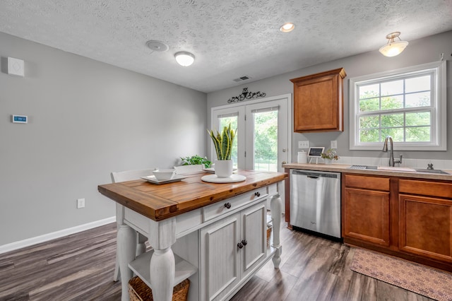 1701 Keating Dr, Louisville, KY 40245 - kitchen with dishwasher, wood counters, dark wood-type flooring, healthy amount of natural light, and a textured ceiling