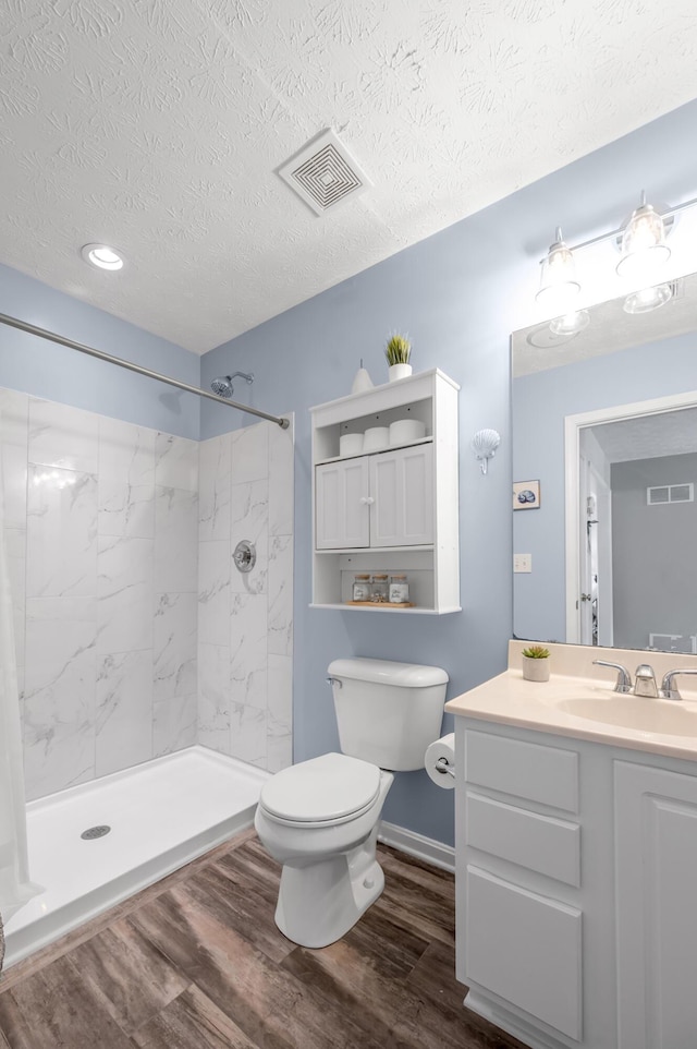 1701 Keating Dr, Louisville, KY 40245 - full bathroom featuring a textured ceiling, wood finished floors, vanity, and a marble finish shower