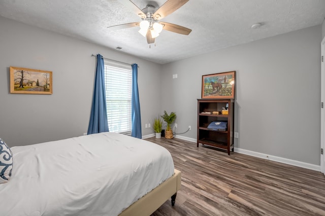 1701 Keating Dr, Louisville, KY 40245 - bedroom featuring a textured ceiling, wood finished floors, and ceiling fan