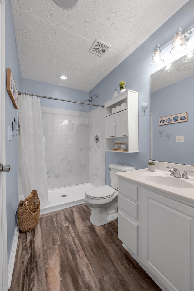 1701 Keating Dr, Louisville, KY 40245 - bathroom with a textured ceiling, vanity, a shower with curtain, and wood finished floors