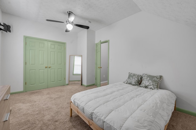 1701 Keating Dr, Louisville, KY 40245 - bedroom with carpet, vaulted ceiling, a textured ceiling, a closet, and a ceiling fan