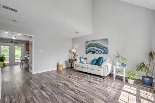 1701 Keating Dr, Louisville, KY 40245 - living room featuring wood finished floors, french doors, and a textured ceiling