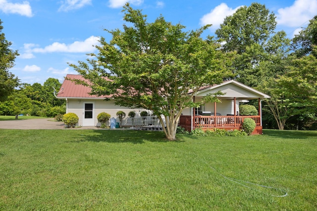 4107 Mine 18 Rd, Strunk, KY 42649 - view of property hidden behind natural elements featuring a porch, a front yard, and a metal roof