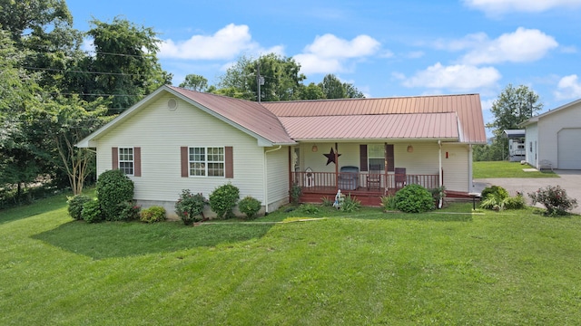 4107 Mine 18 Rd, Strunk, KY 42649 - view of front facade with covered porch, a front lawn, a metal roof, and a garage