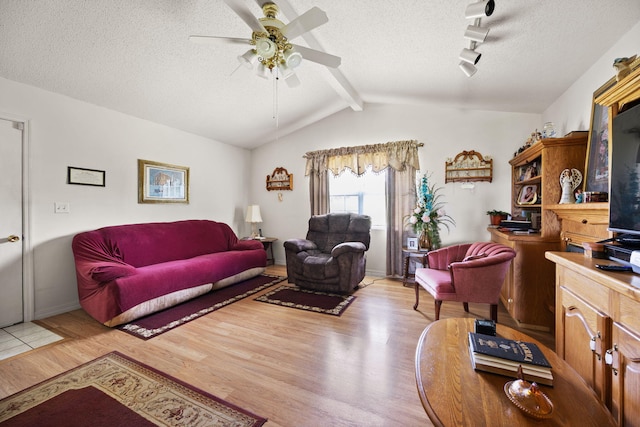 4107 Mine 18 Rd, Strunk, KY 42649 - living area with wood finished floors, ceiling fan, and a textured ceiling