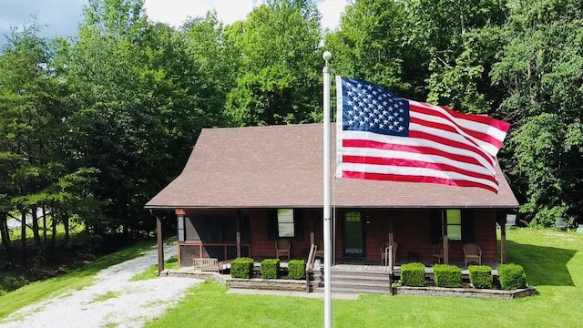 709 Carrington Green Rd, Salt Lick, KY 40371 - view of front of home with a porch, a front lawn, and roof with shingles
