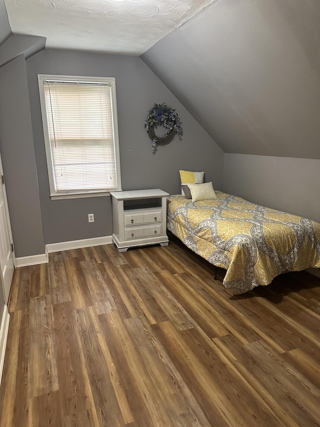 709 Carrington Green Rd, Salt Lick, KY 40371 - bedroom with lofted ceiling and dark wood-type flooring