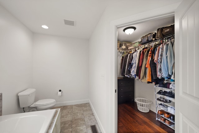 477 Barrington Dr, Somerset, KY 42503 - bathroom with tiled bath and a spacious closet