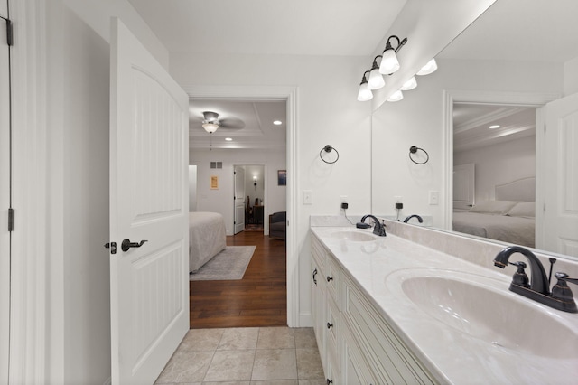 477 Barrington Dr, Somerset, KY 42503 - bathroom with connected bathroom, double vanity, recessed lighting, wood finished floors, and a tray ceiling