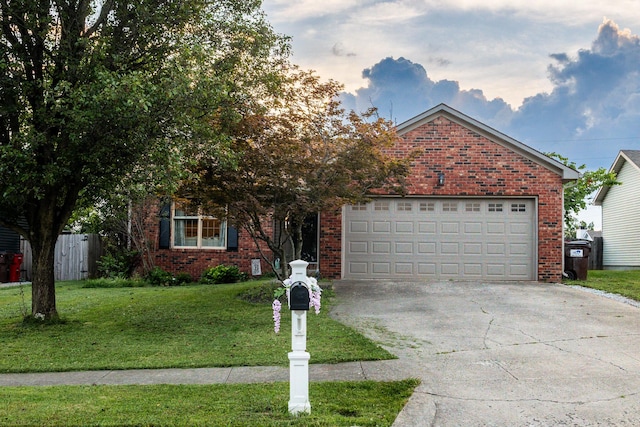 261 Applegrove Dr, Nicholasville, KY 40356 - view of front of house with concrete driveway, brick siding, a front lawn, and a garage