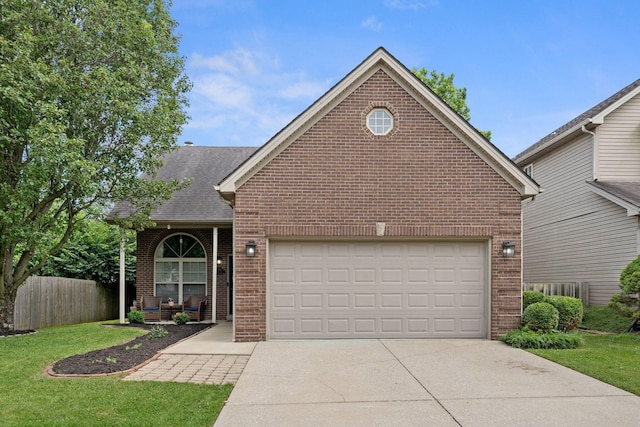 2193 Birkdale Dr, Lexington, KY 40509 - traditional home featuring brick siding, driveway, a garage, and a shingled roof