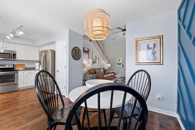 2193 Birkdale Dr, Lexington, KY 40509 - dining room featuring dark wood finished floors, a chandelier, a ceiling fan, and stairway
