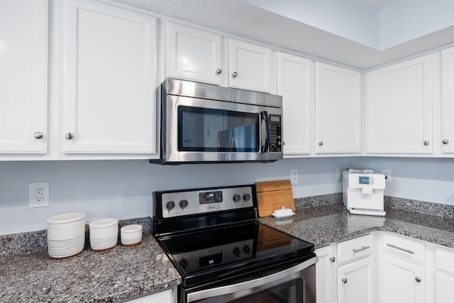 2193 Birkdale Dr, Lexington, KY 40509 - kitchen with appliances with stainless steel finishes, white cabinetry, and dark stone counters