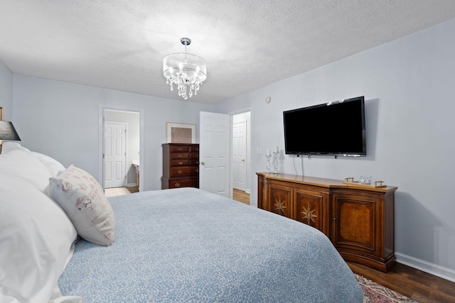 2193 Birkdale Dr, Lexington, KY 40509 - bedroom with dark wood-type flooring, a chandelier, and a textured ceiling