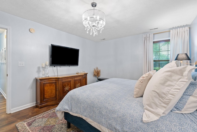 2193 Birkdale Dr, Lexington, KY 40509 - bedroom featuring wood finished floors, a chandelier, and a textured ceiling