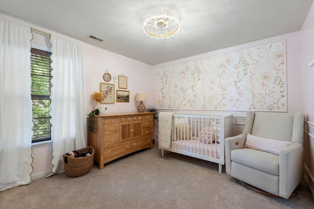 2193 Birkdale Dr, Lexington, KY 40509 - carpeted bedroom featuring a textured ceiling and a nursery area