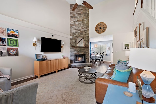 2193 Birkdale Dr, Lexington, KY 40509 - living room featuring high vaulted ceiling, a ceiling fan, wood finished floors, and a stone fireplace