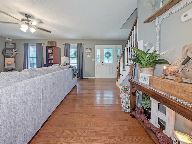 109 Edwards Ct, Lancaster, KY 40444 - entryway featuring wood finished floors, stairway, a textured ceiling, and a ceiling fan